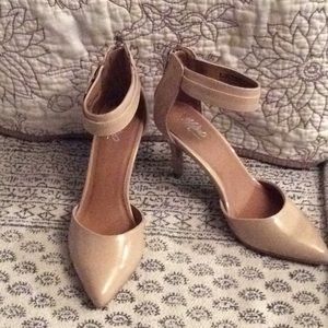Beige high heel shoes